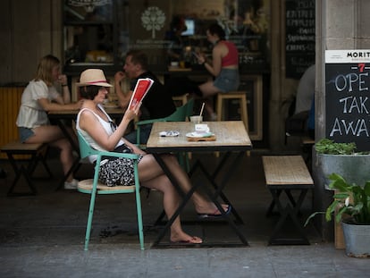Customers at a sidewalk café in Barcelona's Plaza Real.