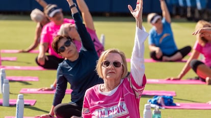 COSTA MESA, CA - OCTOBER 08: Cancer survivor Nancy Warren, 78, center, of Irvine joins other breast cancer survivors in a Hoag Yoga Session on the field at the Hoag Performance Center in Costa Mesa on Tuesday, October 8, 2019. The event, hosted by Hoag, is part of the Los Angeles Chargers efforts to promote breast cancer awareness during Breast Cancer Awareness Month. (Photo by Leonard Ortiz/MediaNews Group/Orange County Register via Getty Images)