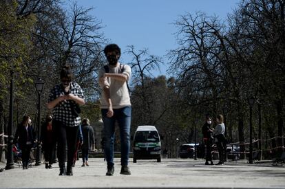 People walking through Madrid’s El Retiro park on March 15.