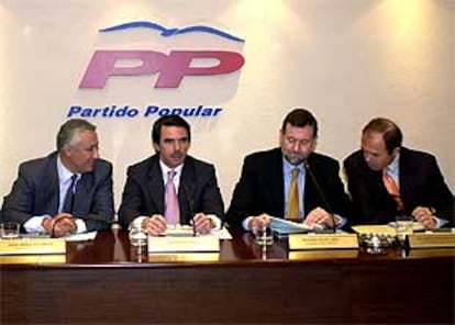 Javier Arenas, José María Aznar, Mariano Rajoy y Pío García Escudero, durante el Comité Ejecutivo del PP.