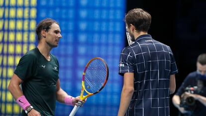 Rafael Nadal of Spain, left, salutes Daniil Medvedev of Russia at the end of their semifinal match at the ATP World Finals tennis tournament at the O2 arena in London, Saturday, Nov. 21, 2020. Medvedev beat Nadal 3-6 7-6(4) 6-3 . (AP Photo/Frank Augstein)