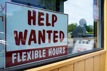 File - A help wanted sign is displayed in Deerfield, Illinois, in 2022.