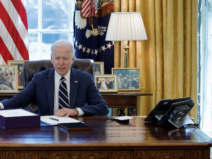 U.S. President Joe Biden signs the American Rescue Plan inside the Oval Office at the White House in Washington, on March 11, 2021.