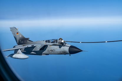 A German Tornado receives fuel from a German Air Force aircraft in the air during Air Defender 23 maneuvers.