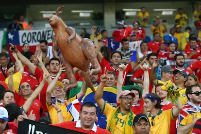 Australianos e chilenos no jogo na Arena Pantanal, em Cuiabá.