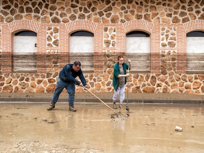 Residents of Toledo cleaning up after the torrential rains.