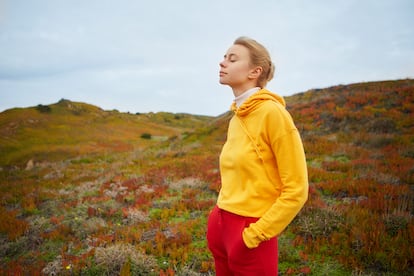 Young woman relaxing near ocean