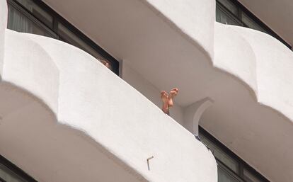 People on the balconies of Palma Bellver Hotel on Tuesday.