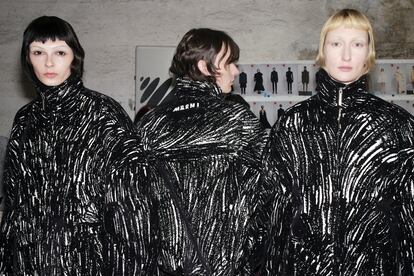 Three models backstage at Marni fall-winter 2024.