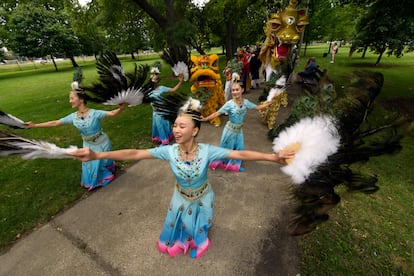 Members of the Tai Ji Men Qigong Academy practice before the Parliament of World Religion Parade of Faiths, Sunday, Aug. 13, 2023