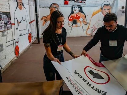 Electoral workers prepares election materials at the National Stadium, which will serve as one of the polling stations for the Constitutional Council election, in Santiago, Chile, Saturday, May 6, 2023.  Chile will vote Sunday to choose 50 delegates to a council that will draw up a new Constitution, after voters overwhelmingly rejected a proposed charter last year. (AP Photo/Esteban Felix)