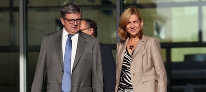 Princess Cristina and her secretary, Carlos García Revenga, after visiting the king in hospital following his recent operation.