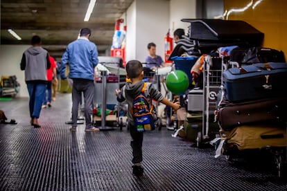 A child plays in the halls.