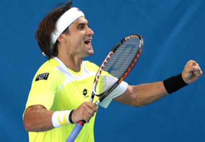 Ferrer celebra un punto ante Raonic.