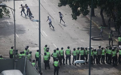 April 8. Protestors flee riot police in Caracas.