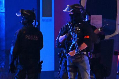 Armed police officers near the scene of a shooting in Hamburg, Germany on March 9, 2023, after one or more people opened fire in a church.