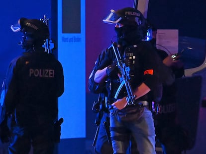 Armed police officers near the scene of a shooting in Hamburg, Germany on March 9, 2023, after one or more people opened fire in a church.