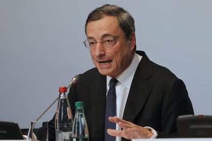 European Central Bank President Mario Draghi reacts to a question at a  post-meeting news conference in Paris on October 2.