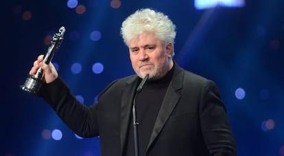 Director Pedro Almodovar from Spain poses with his "European Contributing To World Cinema" award during the European Film Awards in Berlin.