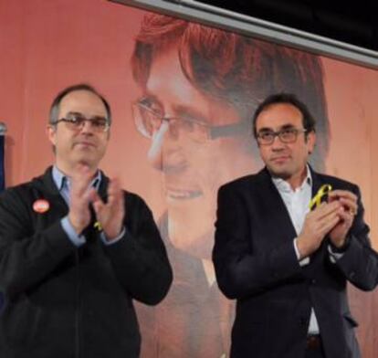 Jordi Turull (i) y Josep Rull, en el acto de este lunes en Barcelona.