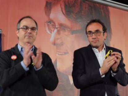 Jordi Turull (i) y Josep Rull, en el acto de este lunes en Barcelona.