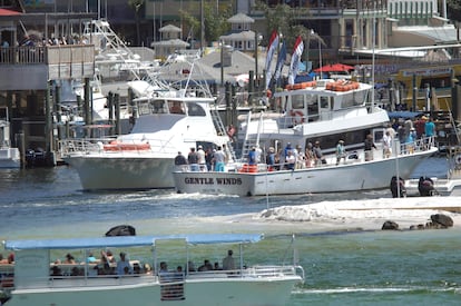 In a Friday April 6, 2012 photo, charter fishing boats go in and out of Destin Harbor in Destin, Fla.