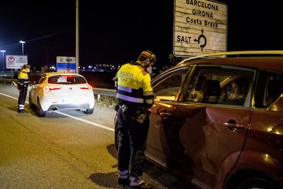 Police at a curfew checkpoint on the AP-7 highway near Girona in Catalonia.  