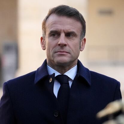 French President Emmanuel Macron reviews the troops with Nigeria's President Bola Tinubu (not pictured), Thursday, Nov. 28, 2024 at the Invalides monument in Paris.  Michel Euler/Pool via REUTERS