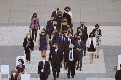 Members of government arrive at the ceremony on Thursday.