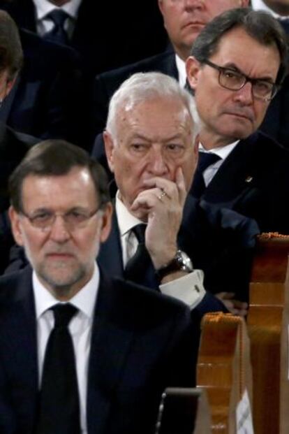 Rajoy, Margallo y Mas durante el funeral por Suárez.
