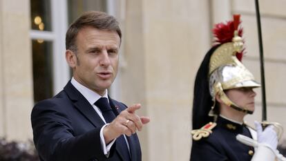French President Emmanuel Macron stands after lunch with the Senegalese President Bassirou Diomaye Faye from the Elysee Palace in Paris, France, 20 June 2024. Andre Pain/Pool via REUTERS
