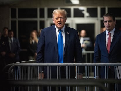 Donald Trump speaks to the media as he leaves the courthouse on April 22 in New York.