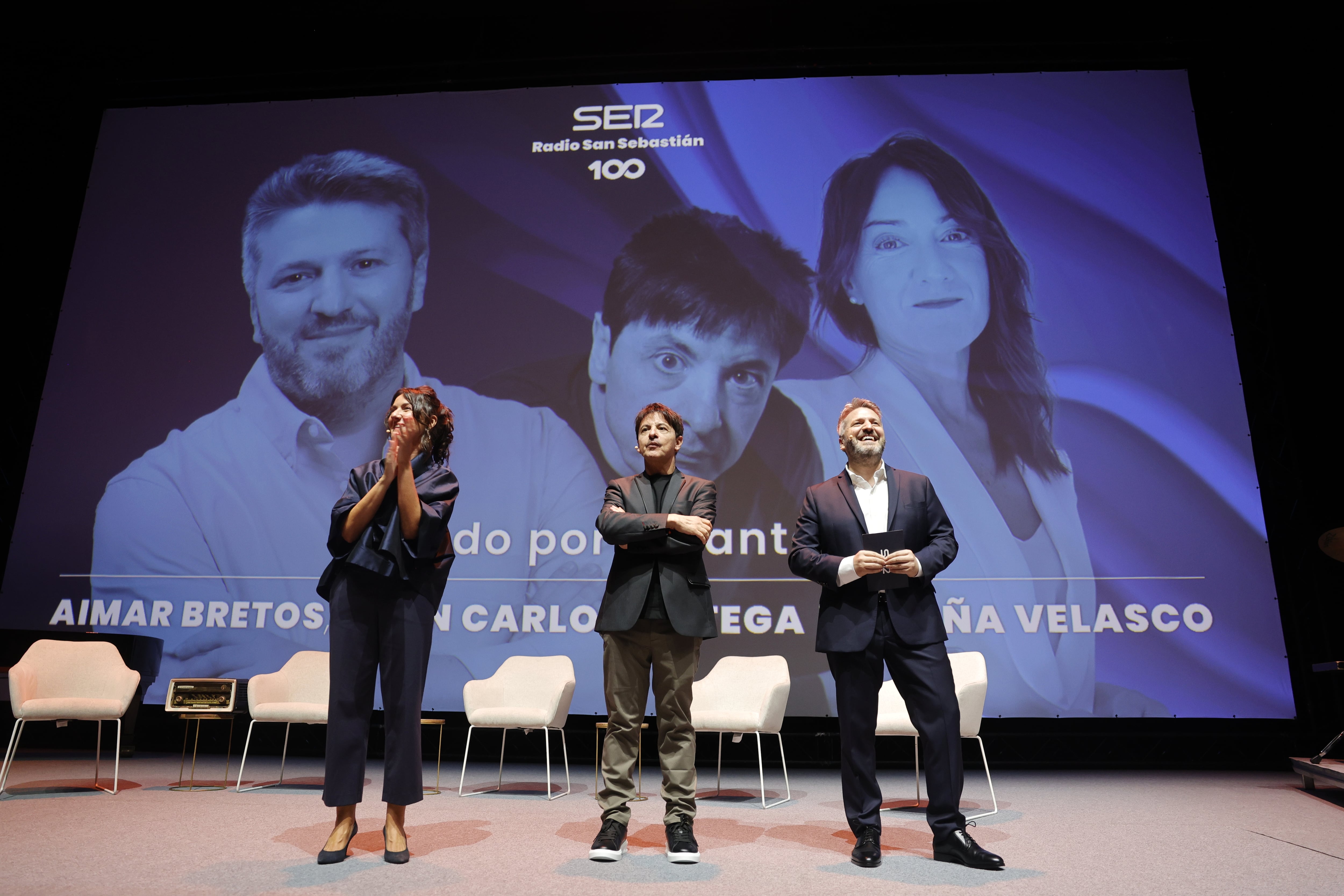Aloña Velasco, Juan Carlos Ortega y Aimar Bretos dirigen este jueves el programa del centenario de Radio San Sebastián en el Kursaal donostiarra.