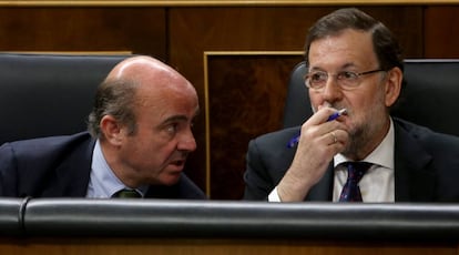 Luis de Guindos y Mariano Rajoy