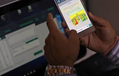 Rohitash Repswal checks a WhatsApp message that he sent using a software tool that appears to automate the process of sending messages to WhatsApp users, inside his office in New Delhi