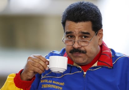 President Nicolás Maduro has a cup of coffee at the 6th annual Caracas Book Fair on Saturday.