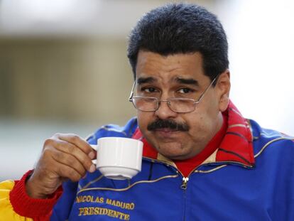President Nicolás Maduro has a cup of coffee at the 6th annual Caracas Book Fair on Saturday.