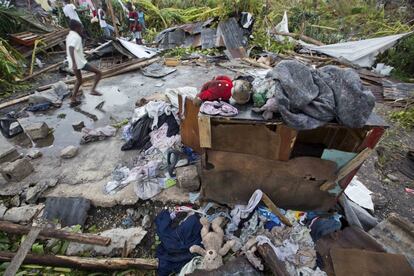 Personal items lie scattered outside homes destroyed by Hurricane Matthew in Les Cayes, Haiti, Thursday, Oct. 6, 2016. Two days after the storm rampaged across the country's remote southwestern peninsula, authorities and aid workers still lack a clear picture of what they fear is the country's biggest disaster in years. (AP Photo/Dieu Nalio Chery)