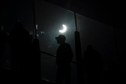 People watch a rare "ring of fire" solar eclipse along the Las Vegas Strip.