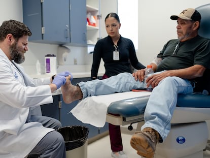 Dr. Michael Sobolevsky cares for his patient Jesús Resendez at the University Health Diabetes Institute in San Antonio, Texas.