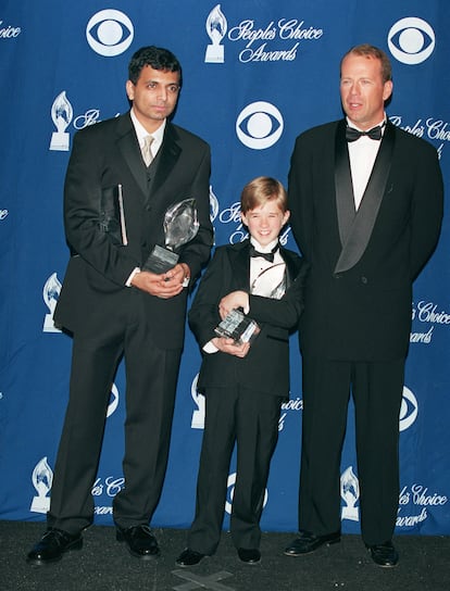 N. Night Shyamalan, Haley Joel Osment and Bruce Willis.