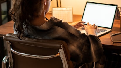 Teen girl doing homework on her laptop