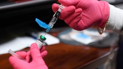 Health personnel prepare a measles, mumps and rubella vaccine in Andrews County, Texas, on April 8, 2025.