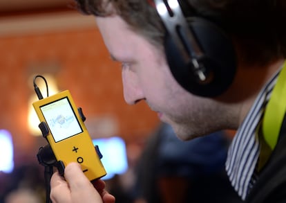 A man listens to the doomed PONO.