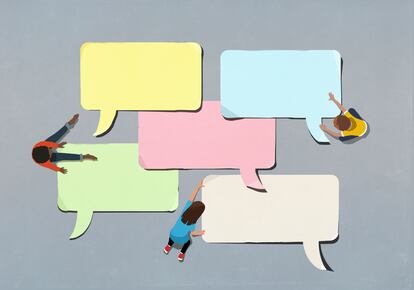 Kids arranging blank multicolor speech bubbles