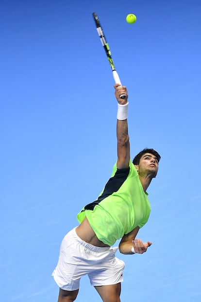 Alcaraz serves during a match at the ATP Finals in Turin.