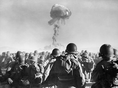 U.S. soldiers watching an atomic test.