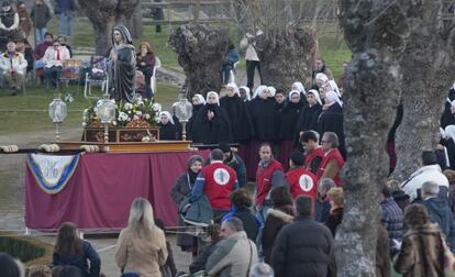 Followers pray at the site where the Virgin Mary is first said to have appeared to Luz Amparo.