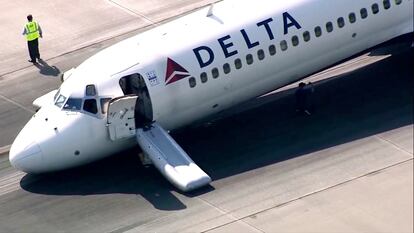 A Delta plane lands without its landing gear at the Charlotte Douglas International Airport, on June 28, 2023, in Charlotte, N.C.