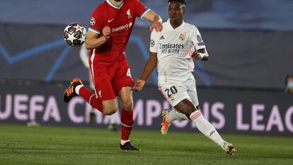 Real Madrid forward Vinicius Jr. and Liverpool defender Nathaniel Phillips.